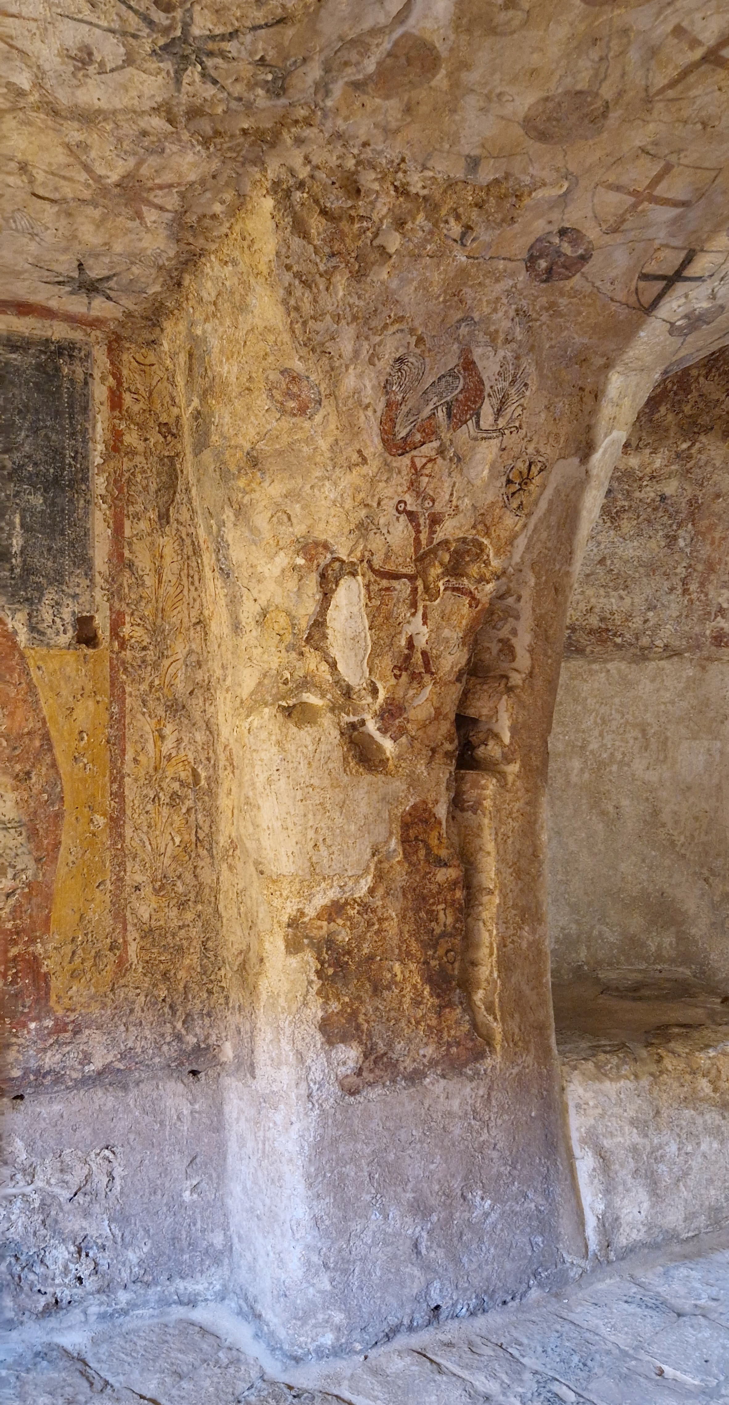 Fig. 5. Crypt of the Crucifix: semi-pillar decorated with a Greek cross surmounted by a peacock.